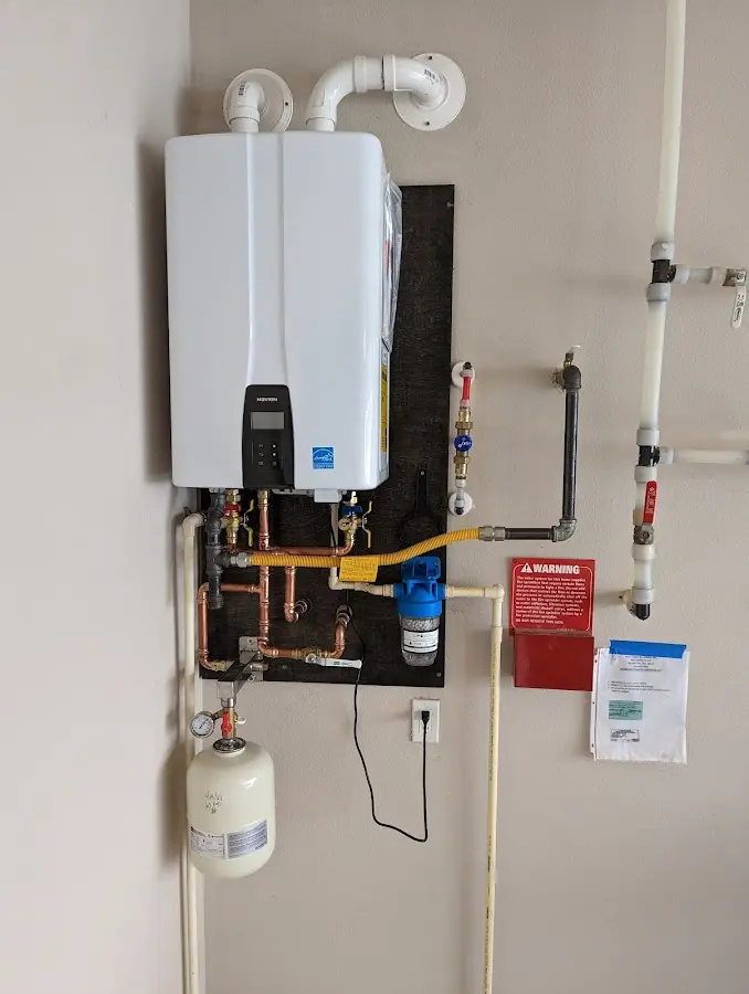 Professional plumber installing copper piping in a Bonne Terre home